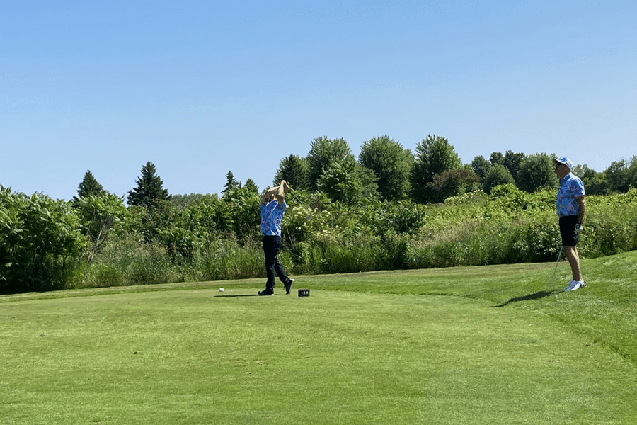 Miura's Ryan Boyd takes a swing on hole 8